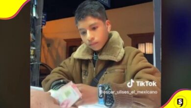 vendedor niño dinero celular
