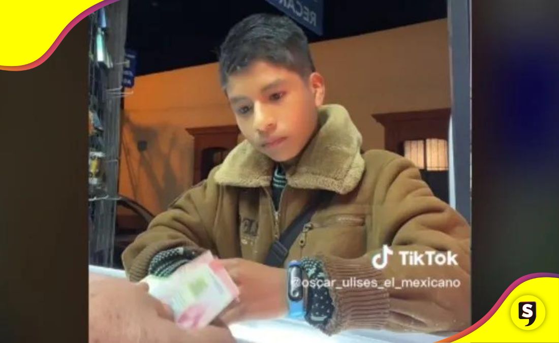 vendedor niño dinero celular